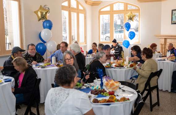 Logan Vistas Apartments residents enjoy anniversary lunch